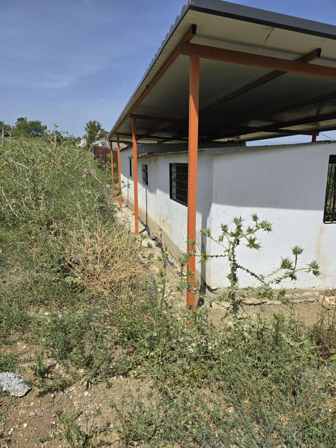 Parcela rustica con una casa registrada para reformar