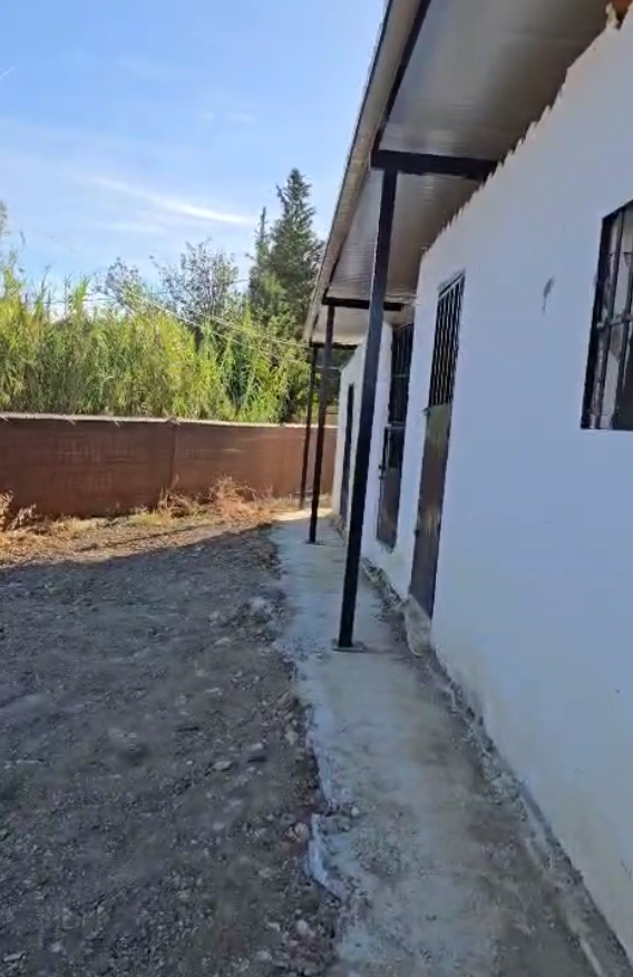 Parcela rustica con una casa registrada para reformar