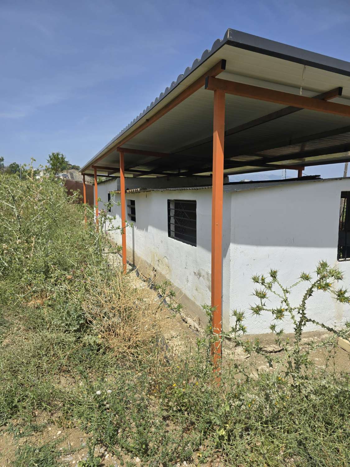Parcela rustica con una casa registrada para reformar