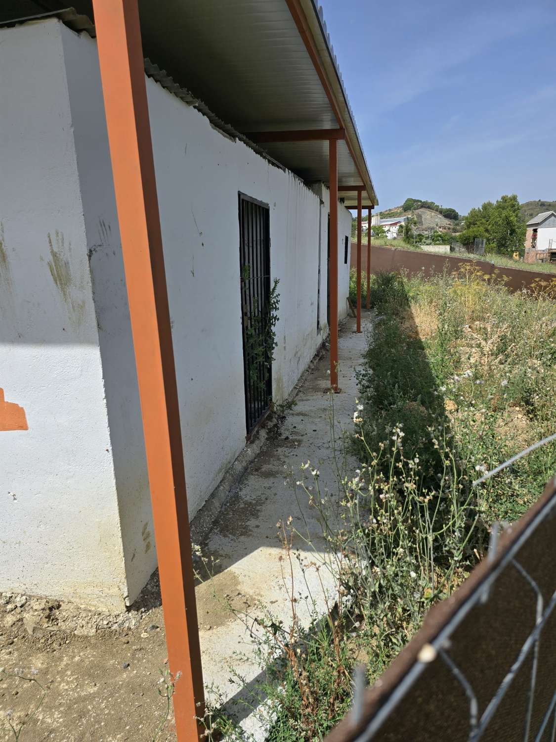 Parcela rustica con una casa registrada para reformar