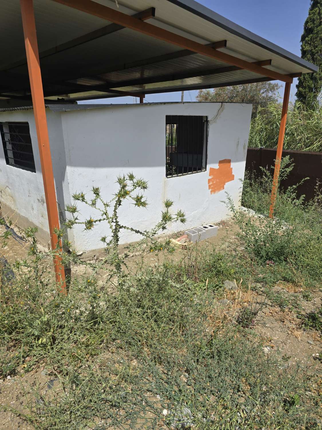 Parcela rustica con una casa registrada para reformar